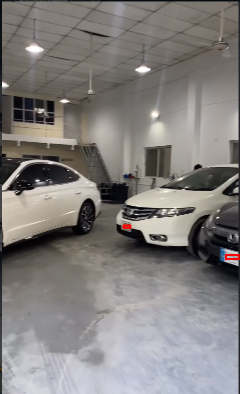 FixMyVehicle warehouse with multiple vehicles being serviced in Islamabad